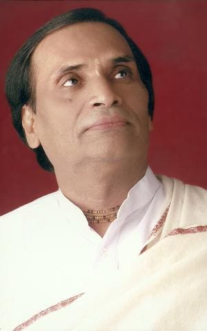 Earlier portrait of Kavi Narayan Agrawal in white against a red background
