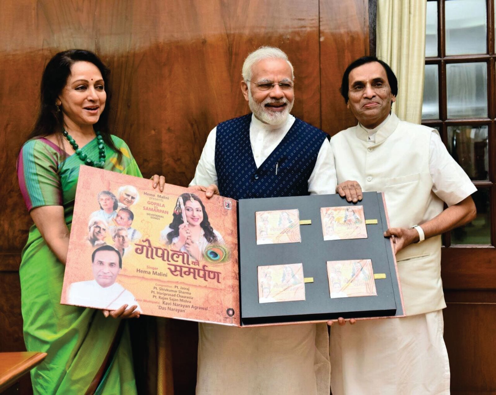 Hon'ble Prime Minister Shri Narendra Modi with Smt. Hema Malini Ji and Kavi Narayan Agrawal at the release of Gopala Ko Samarpan