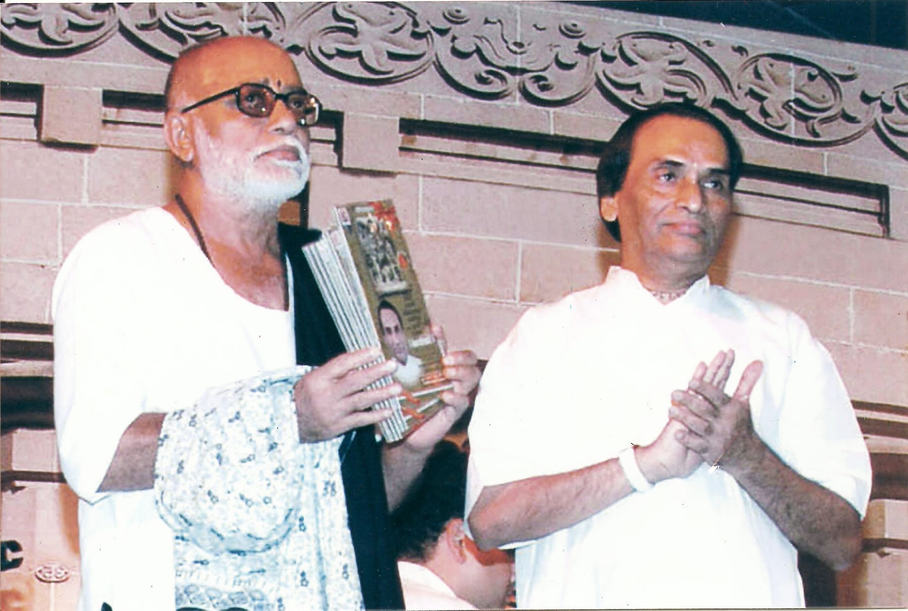 Sant Morari Bapu releasing Kavi Narayan Agrawal's Amrit Vani